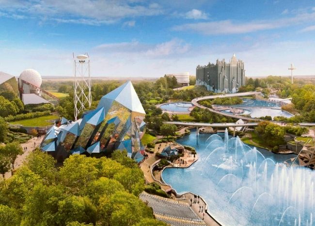 Vue aérienne du parc du Futuroscope avec ses attractions futuristes, espaces verts et bassins paysagers