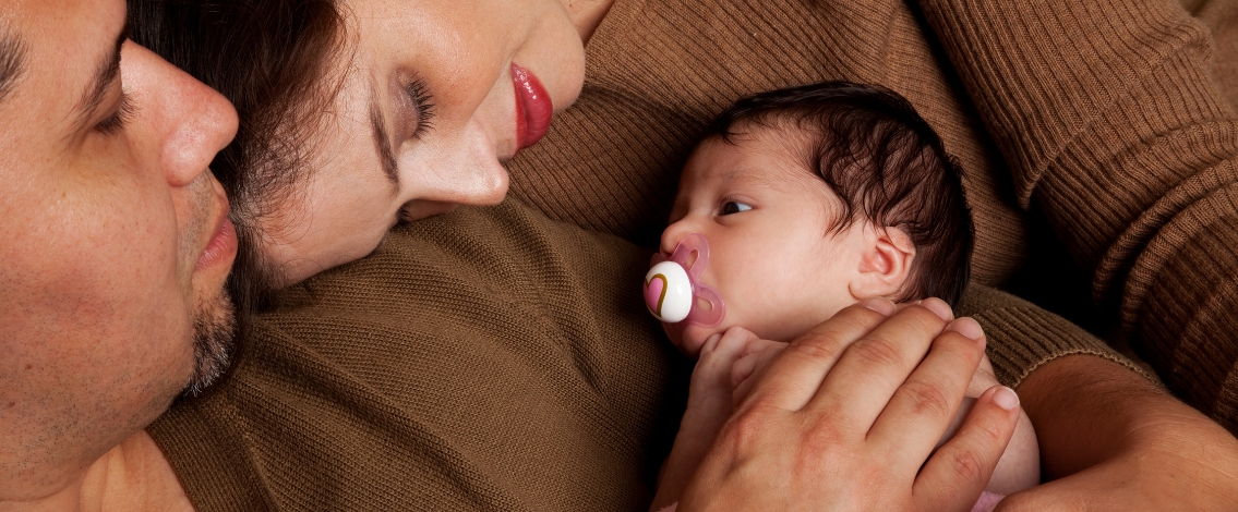 Young family with a baby: Captures a tender family moment, often associated with early parenthood.